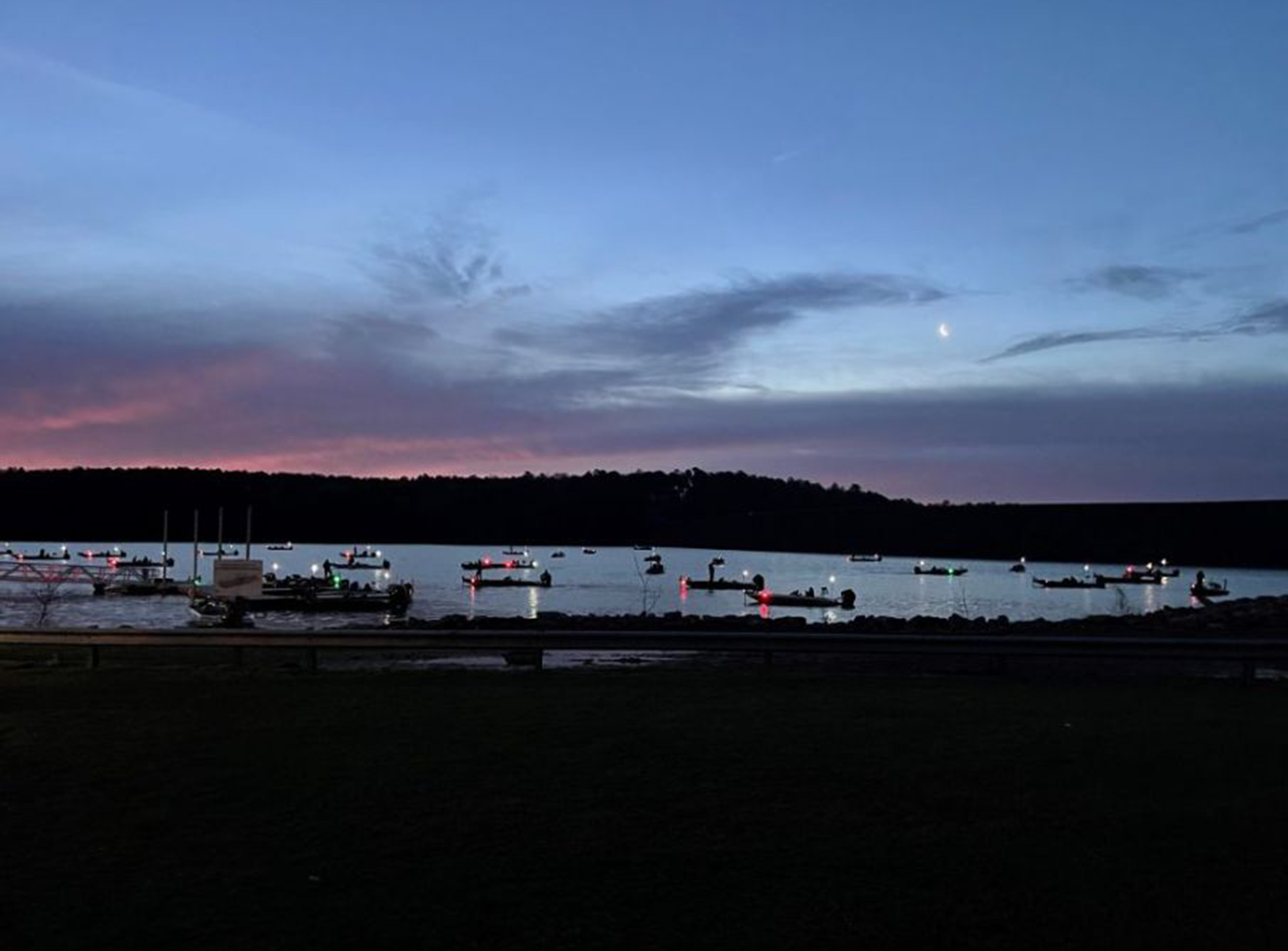 Tournament boats on lake, pre-dawn.